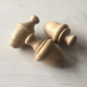 Wooden acorn shaped light pull made from American Oak Handmade in UK