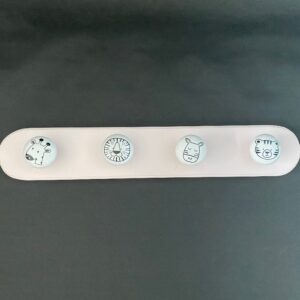 Stylish Children's Wood and Ceramic Coat Hooks finished in either pink  or waxed oak.  Handmade in UK